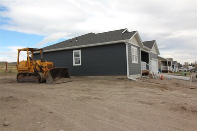 View of side of property featuring roof with shingles