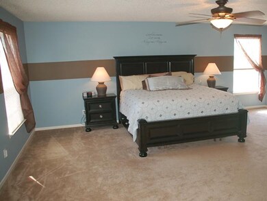 Master Bedroom. Master Bedrroom Suite with three windows, and ceiling fan/light