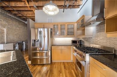 Kitchen featuring appliances with stainless steel