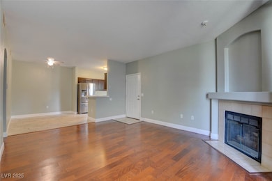 Unfurnished living room featuring a fireplace, cei