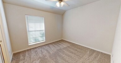 Carpeted empty room with healthy amount of natural
