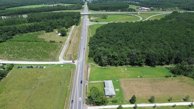 Birds eye view of property featuring a rural view