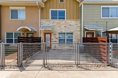Townhome / multi-family property with stone sidin