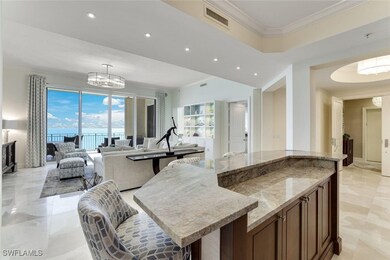 Kitchen with a chandelier, recessed lighting, ligh