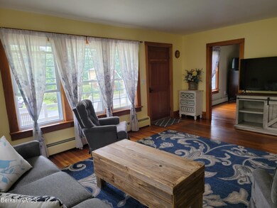Living toward front porch & front bedroo