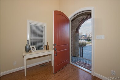 Covered porch leads to the inviting foyer.
