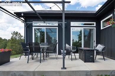 There are multiple patios for optimum comfort and views from almost any section of this custom home.