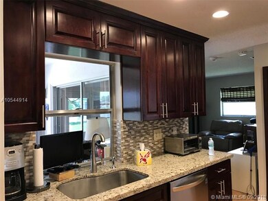 UPGRADED KITCHEN WITH CROWN MOLDING & GRANITE