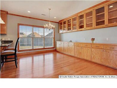 Dining area with wood floors and additional cabine