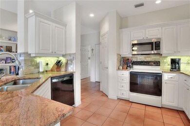 Kitchen features granite/marble backsplash