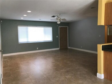 Light, bright family room with porcelain tile