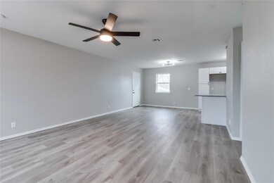 Empty room featuring light hardwood / wood-style f