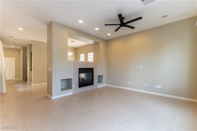 Unfurnished living room with ceiling fan, light ti