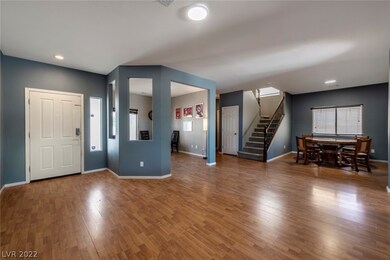 Living Room Open to Dining Room & Den