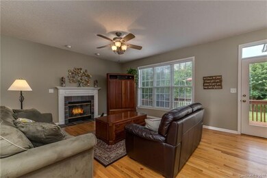 Family room with gas log fireplace and access to d