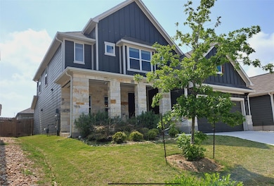 View of front of home with board and batten sidin