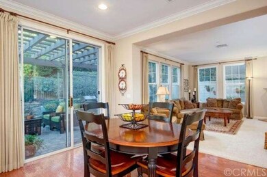 Gourmet kitchen with granite counters opens to a s