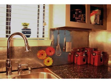 Kitchen view of a sink and backsplash