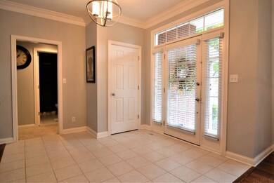 BEAUTIFUL TILE FOYER WITH COLUMNS AND LOTS OF NATU