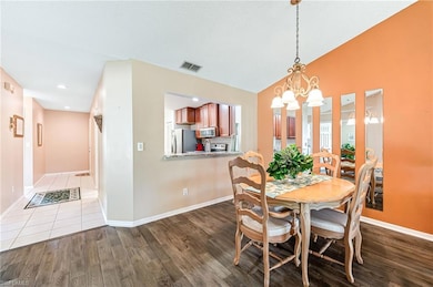 Dining room with a chandelier, wood finished floor