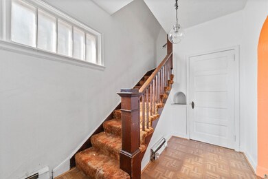 Stairs featuring parquet flooring and baseboard he