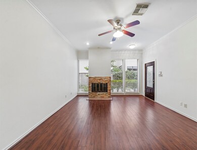 Tons of natural light accent a beautiful fireplace