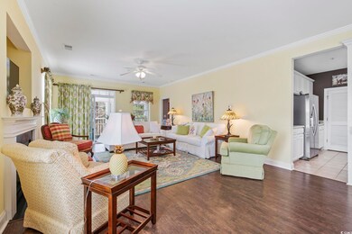 Living room with ornamental molding, visible vents