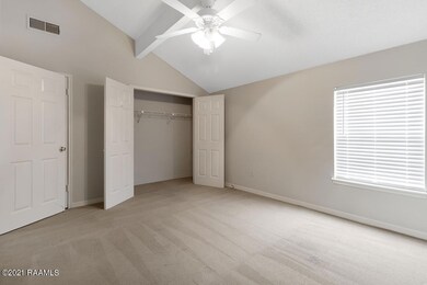 Upstairs bedroom with vaulted ceilings.