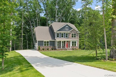 Craftsman-style house with a front yard