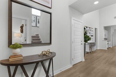 Hallway with light wood-type flooring, baseboards