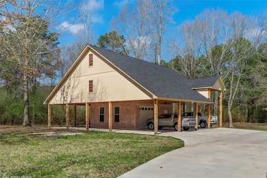 View of front facade with a front lawn, driveway, 