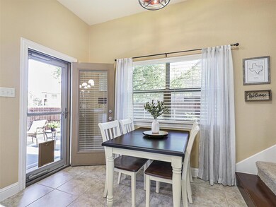 Tiled dining room featuring plenty of natural ligh