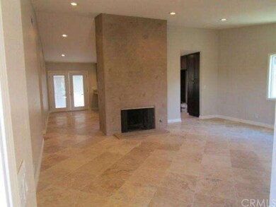 Dyed cement fireplace with cat-scratch finish; wel