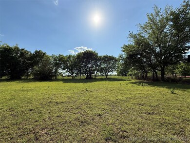 View of grassy yard with a view of countryside