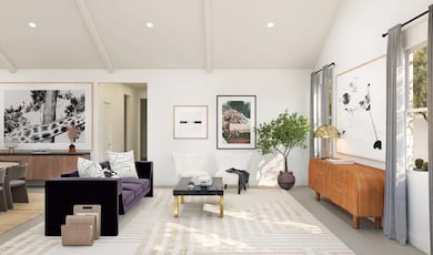Great room with vaulted ceiling and white-painted ceiling beams