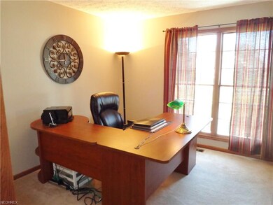 The office is to the side of the front foyer throu