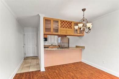 Entrance to condo. Laundry closet across from kitchen