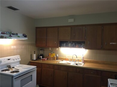 Kitchen, range, range hood, two refrigerators stay