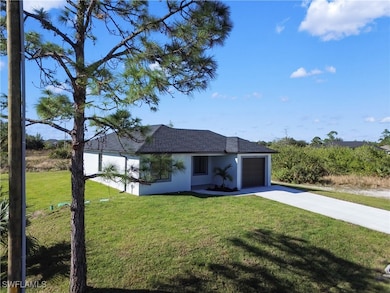 View of front of property with a garage and a fron