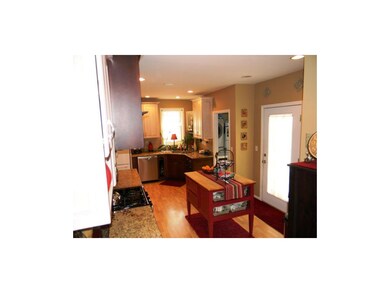 More kitchen alternate view. Note the laundry in t