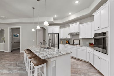 The kitchen is outstanding with plenty of room for 4 bar stools open to the family room.