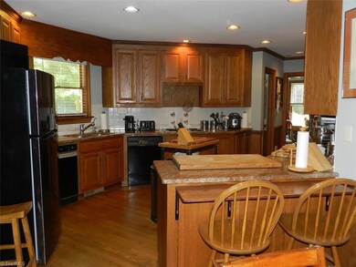 Dining Room to the left of foyer, double doors entering into kitchen.