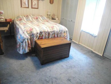 Bedroom. This sunken bedroom is privately situated