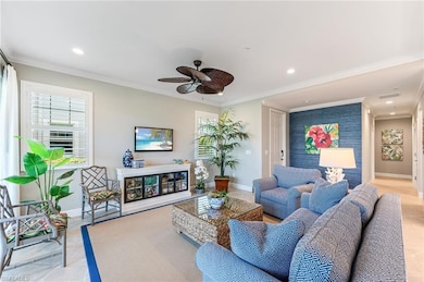 Living area featuring ornamental molding, ceiling 