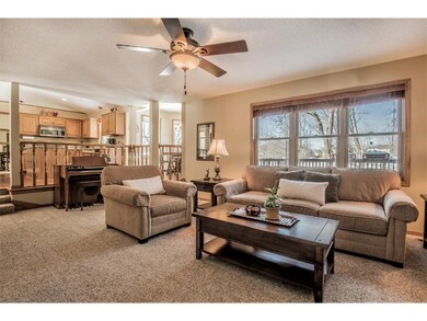Family room with wall of windows offering serene y