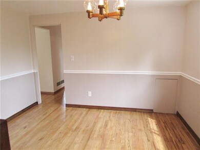 DINING ROOM WITH CHAIR RAIL AND LARGE PANTRY