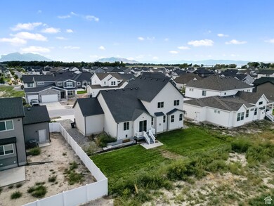 Aerial perspective of suburban area featuring a mountain backdrop