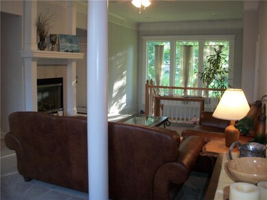 Great room with fireplace, ceiling fan, amazing wi