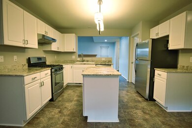 View into kitchen from breakfast space