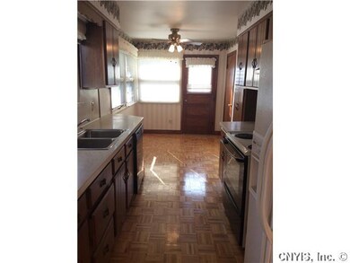 Kitchen. Galey kitchen with an eat in area and doo